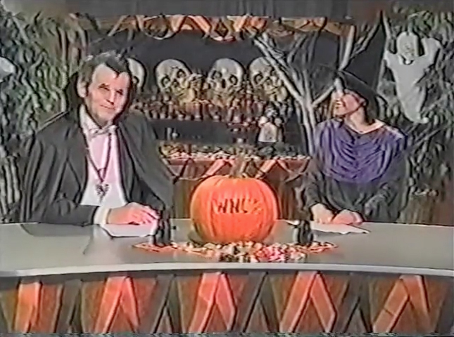 "WNUF Halloween Special" newscasters getting in character.