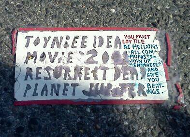 Toynbee Tile Idea Movie 2001 Resurrect Dead Planet Jupiter, spotted on W. Franklin St at corner of Eutaw and Franklin.