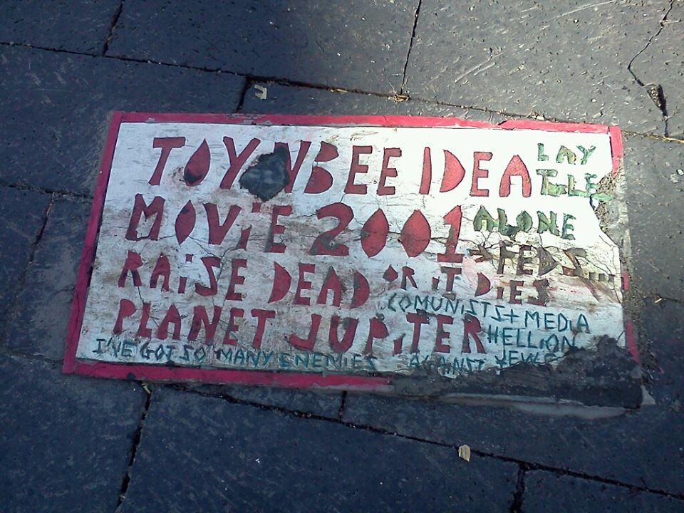 Toynbee Tile on W. Franklin Street crosswalk, intersection of Franklin and Howard Street.